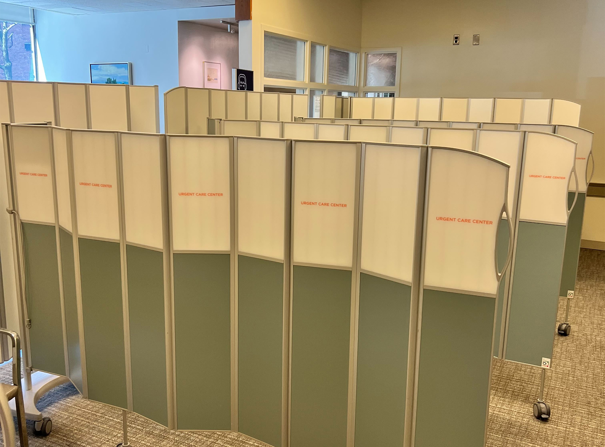 Emergency department check-in area with temporary mobile folding screens